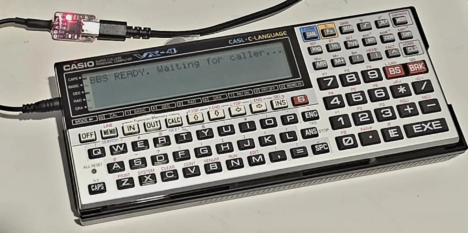 Casio VX-4 connected by serial cable and used as a BBS host