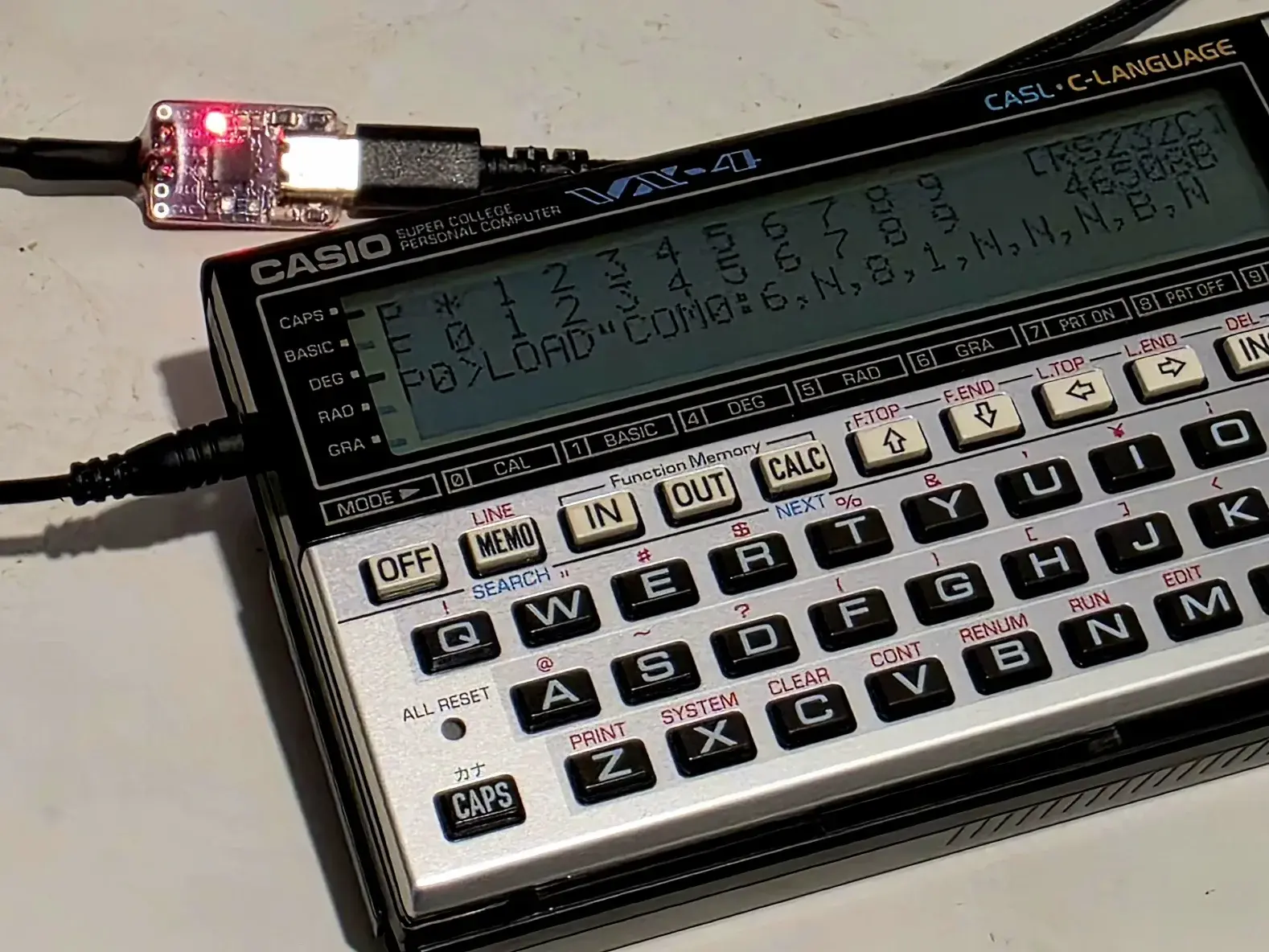 Casio VX-4 in COM mode connected to an RS-232 USB serial cable