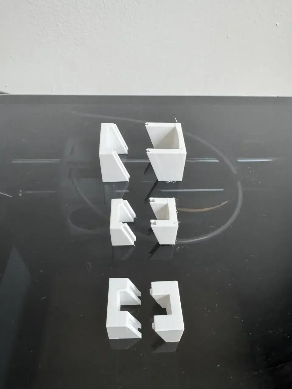 Three 3D-printed CinderClock dovetail joint tests with different tolerances