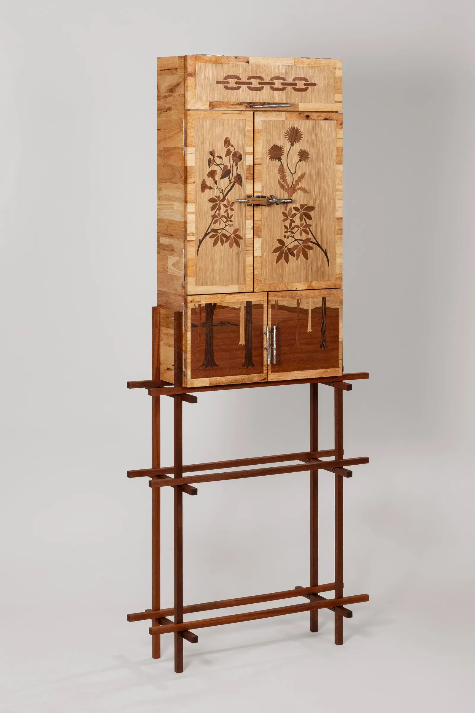 Dark rubberwood cabinet covered with colorful geometric marquetry patterns
