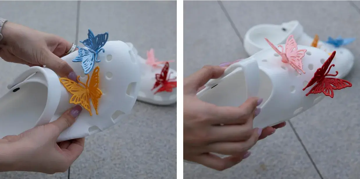 Hands bending a white 3D-printed TPU clog to show its flexibility