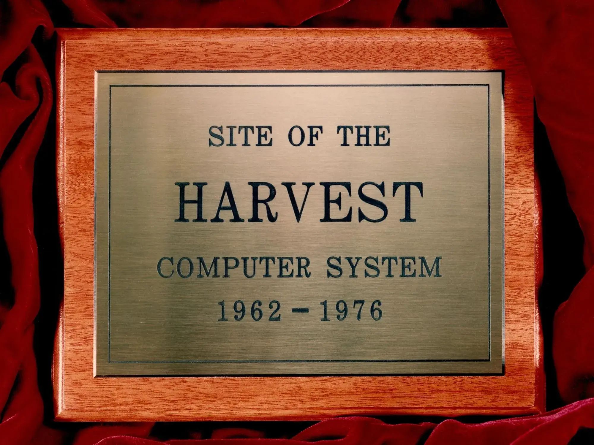 Wooden plaque with etched bronze plate reading “Site of the Harvest computer system, 1962-1976”