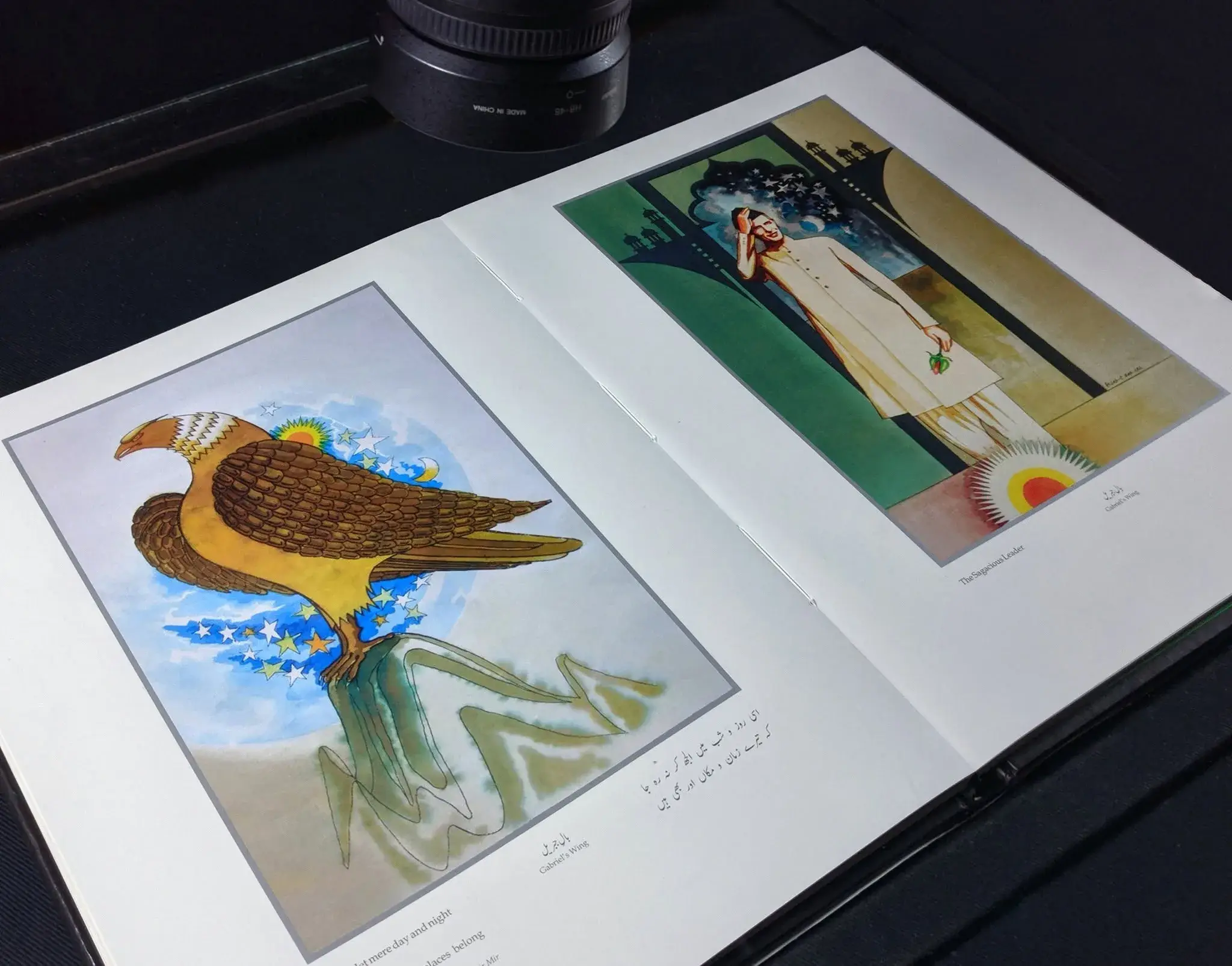 A consumer Nikon camera mounted above a homemade book-digitization table with a glass platen