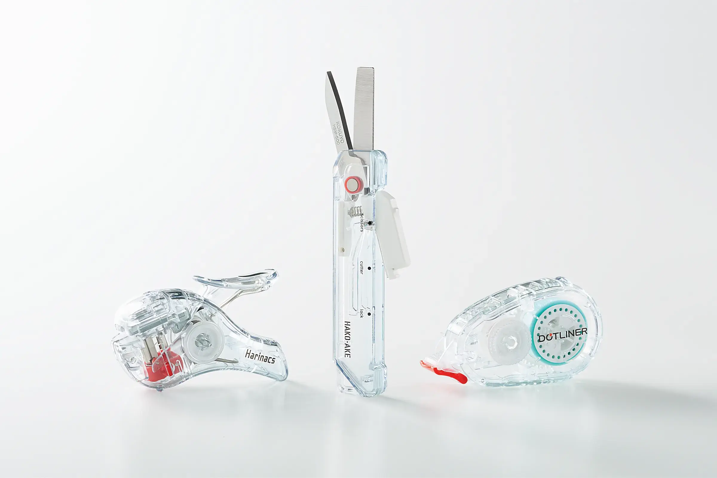 Collection Transparent Mechanism de Kokuyo avec agrafeuse sans agrafes, ciseaux et colle en ruban transparents