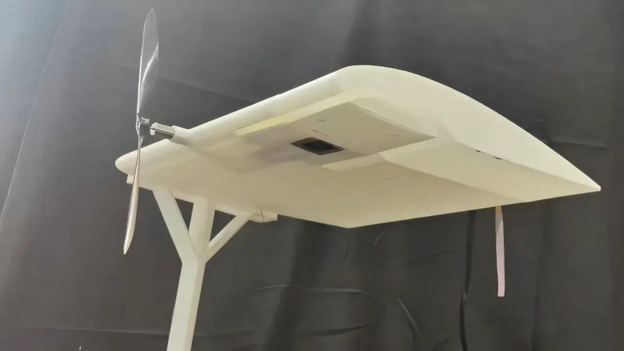 Photovoltaic and thermoelectric receiver installed beneath a model drone wing for laser-power testing
