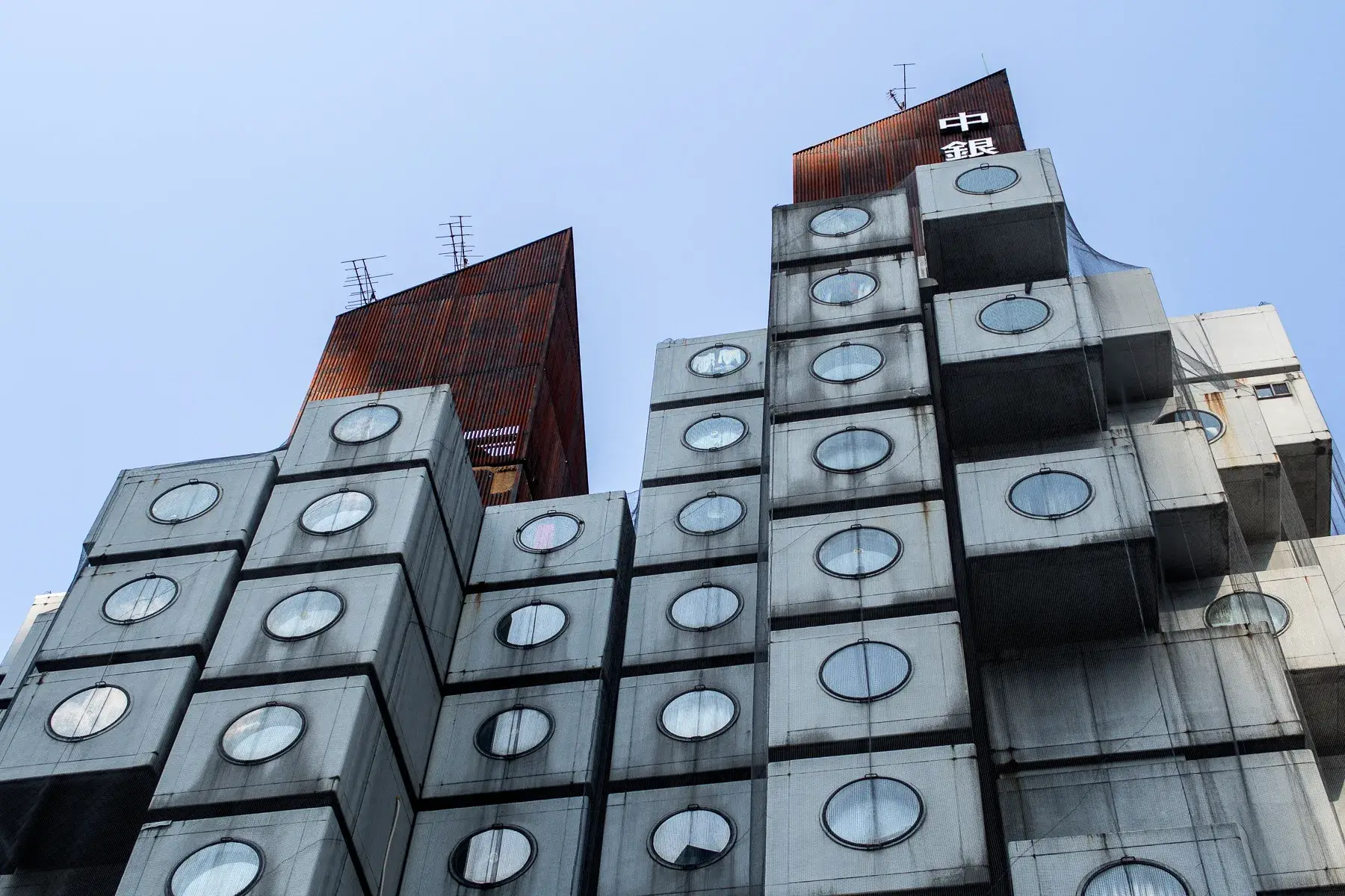 Nakagin Capsule Tower in Tokyo, with prefabricated capsules attached to two concrete cores