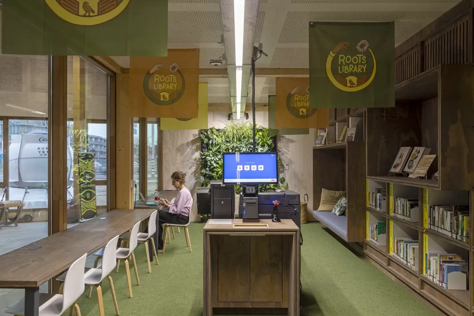 Interior of the Roots Library at OBA Next Lab, with furniture and timber structure