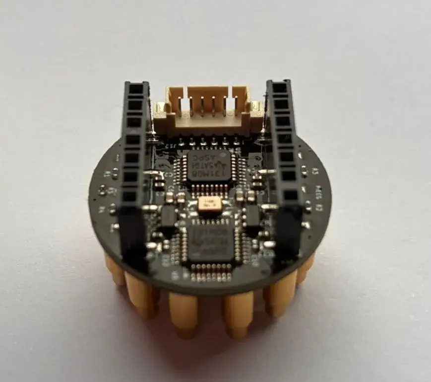 Circular Octopus 16 board fitted with pogo-pin contacts for EEG signal measurement