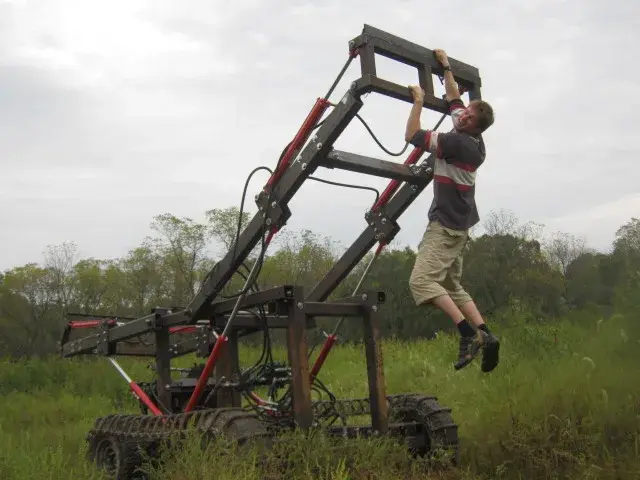 The LifeTrac II, Open Source Ecology's open-source tracked tractor, in a field