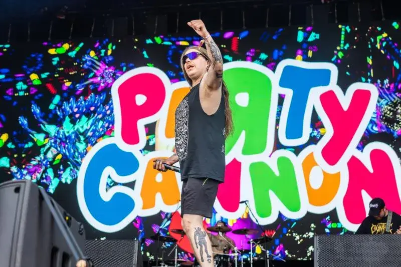 Party Cannon performing at Bloodstock with colourful branding and handmade stage props