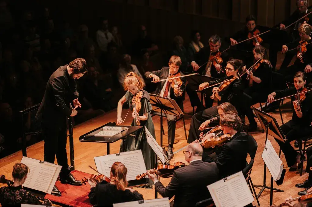 The musicians of Orkest Phion on stage, the image the moving typography is often set over