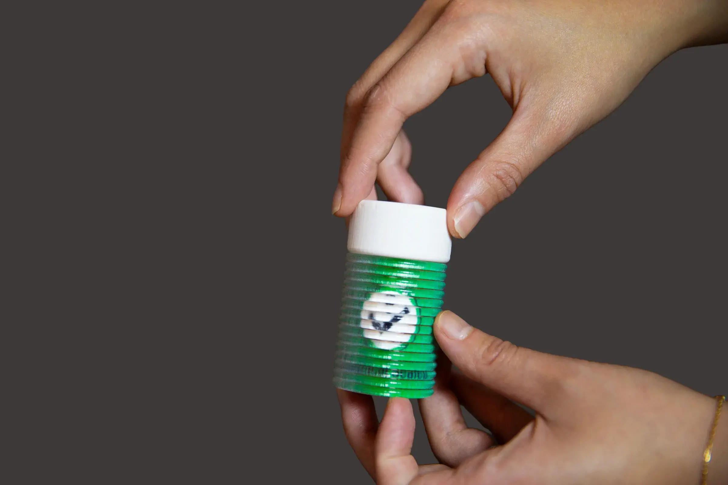 3D-printed chemical bottle from ShiftLens that changes appearance according to the state of its cap