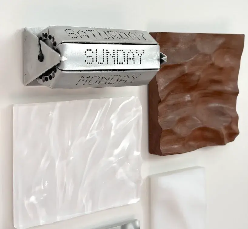 Stupid Engineering Day Display, a minimal wall-mounted aluminium weekday calendar