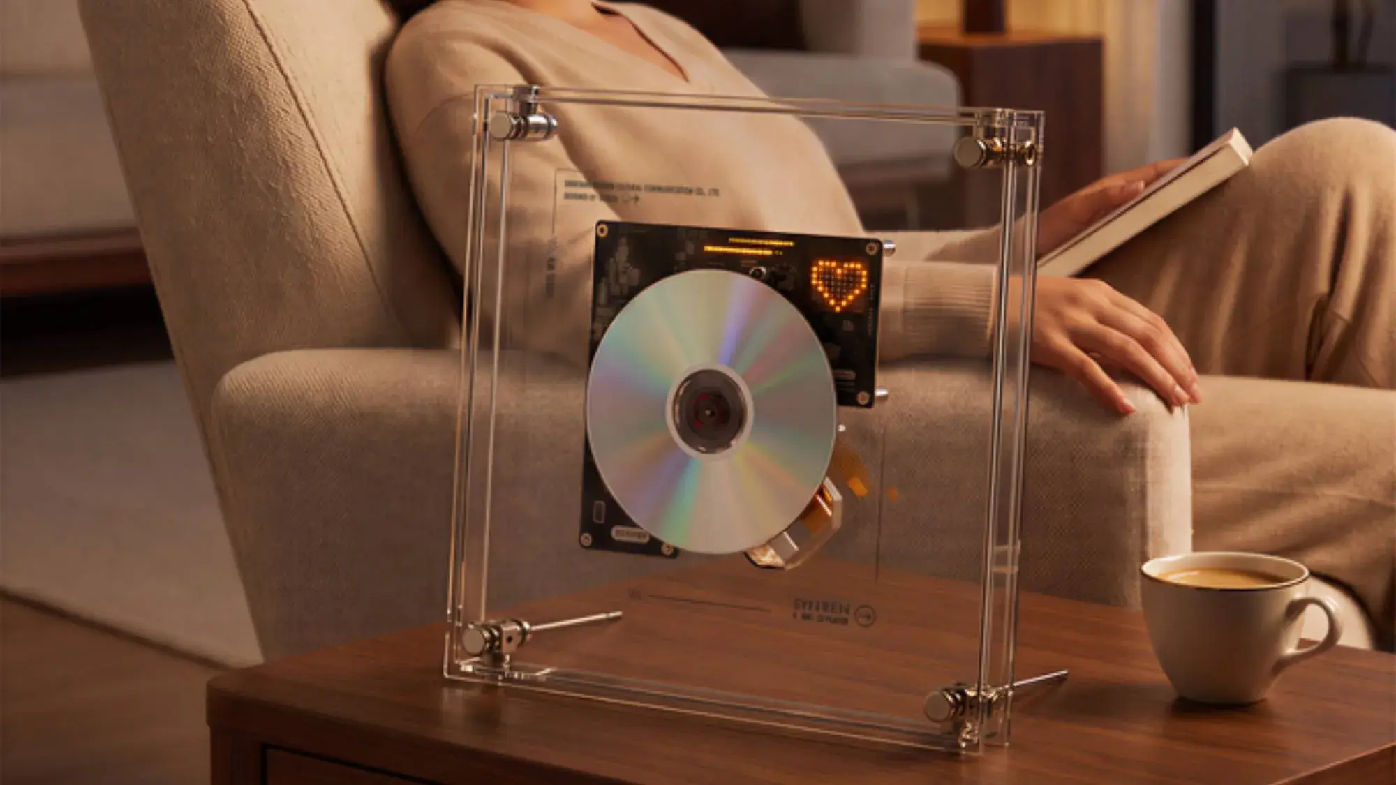 Transparent Syitren RM1 CD player standing upright with a disc on display